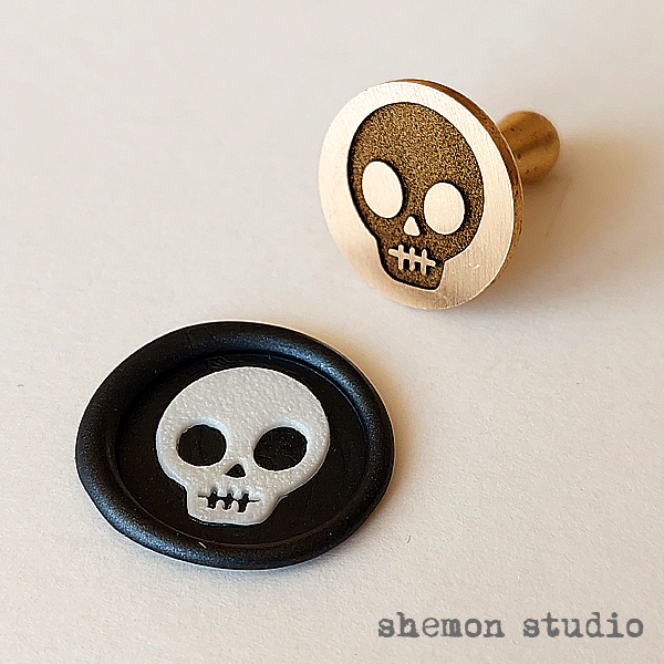 مهر برنجی طرح جمجمه